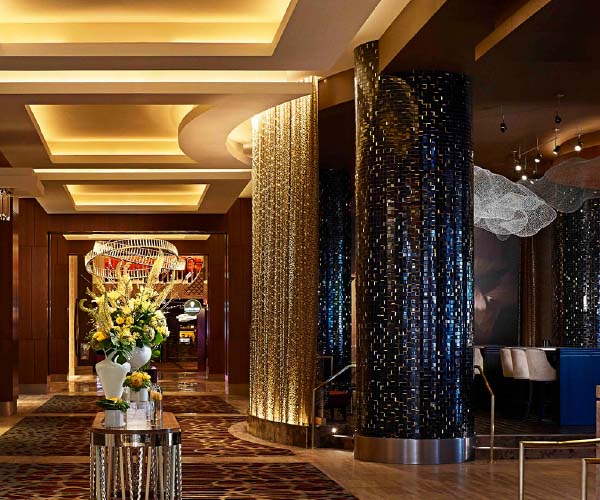 Decorative column design using architectural vinyl film revamps a lobby.